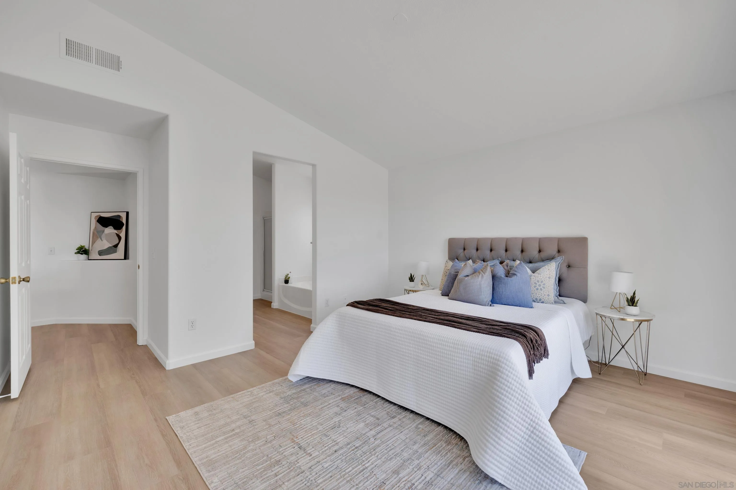 2334 Columbine Road Alpine, CA 91901 - Photo 33 of 42 a bedroom with a bed and wooden floor