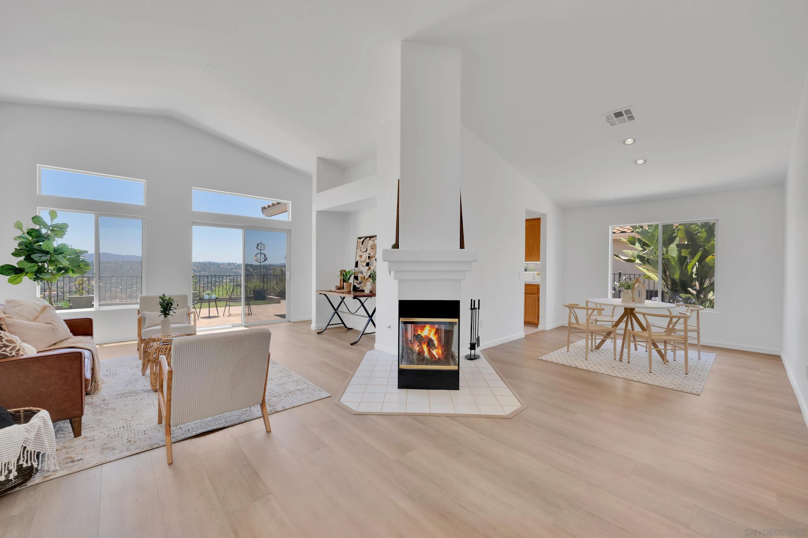2334 Columbine Road Alpine, CA 91901 - Photo 4 of 42 a living room with furniture a fireplace and a table