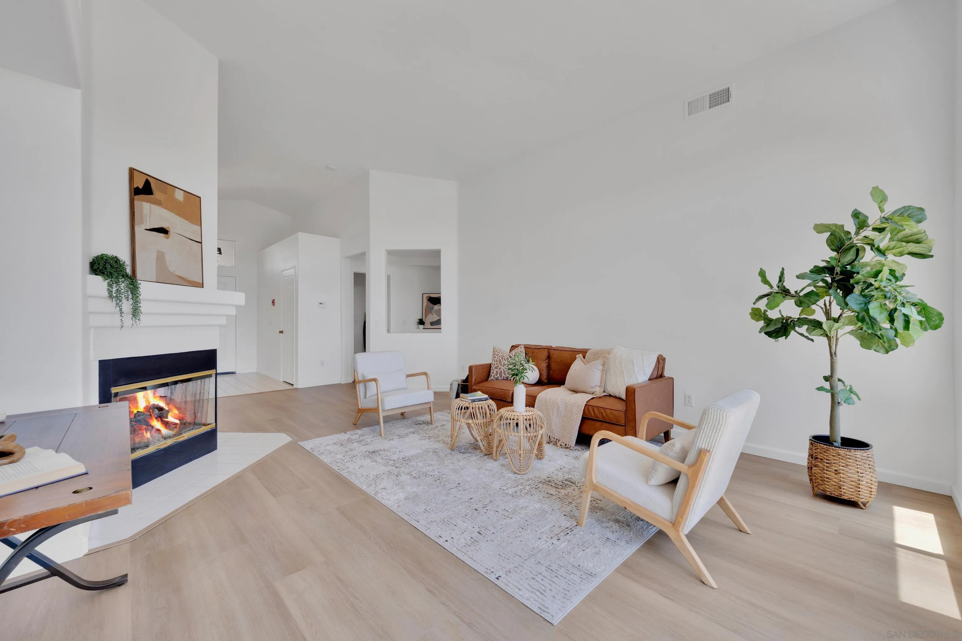 2334 Columbine Road Alpine, CA 91901 - Photo 6 of 42 a living room with furniture a fireplace and potted plants
