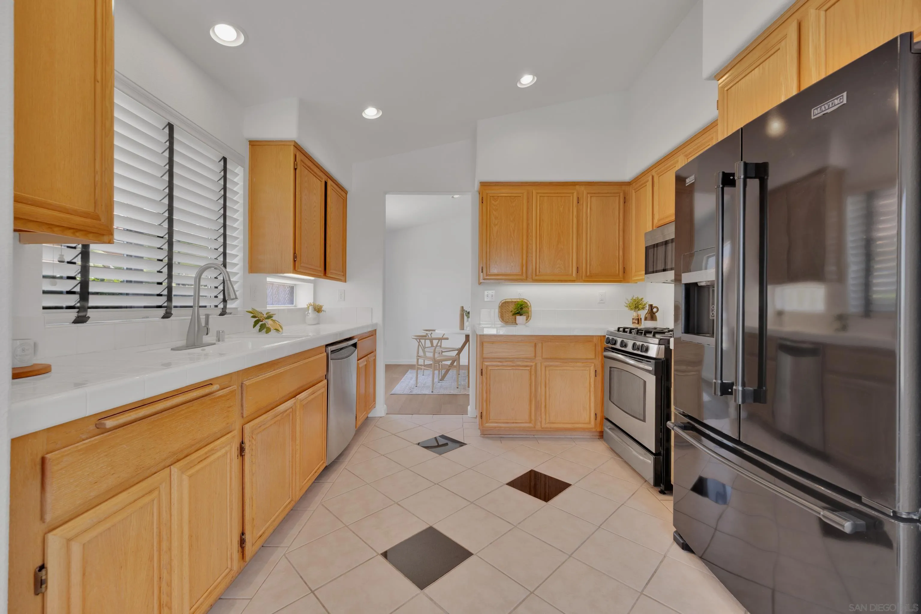 2334 Columbine Road Alpine, CA 91901 - Photo 9 of 42 a large kitchen with kitchen island a sink stainless steel appliances and cabinets
