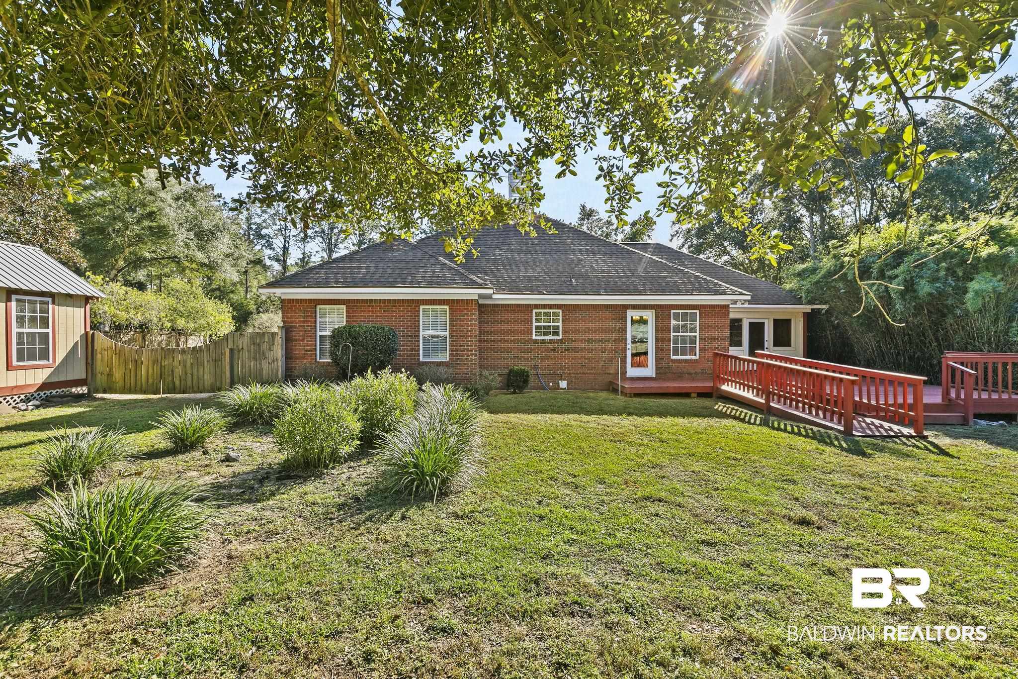 9631 Bay Meadows Avenue Fairhope, AL 36532 - Photo 41 of 49 Rear view of property with a lawn and a wooden deck