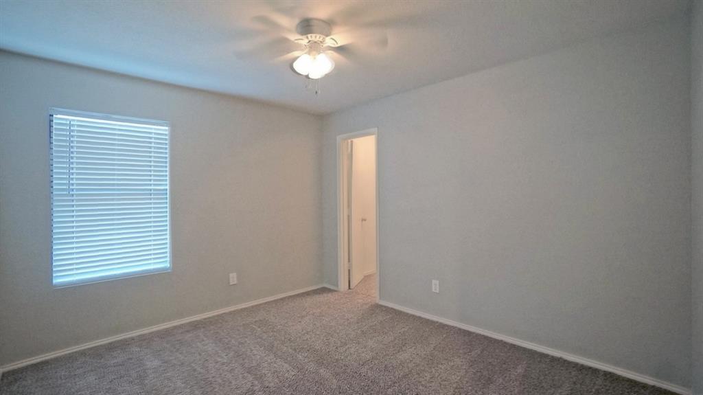 12005 Arbor Lake Road Rhome, TX 76078 - Photo 16 of 22 Unfurnished room with carpet and a ceiling fan