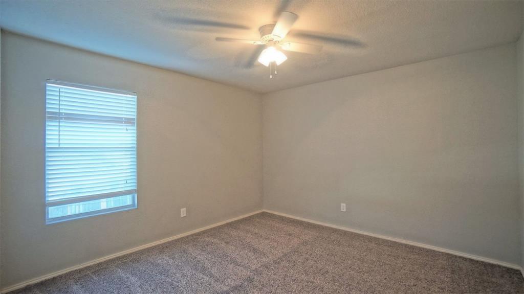 12005 Arbor Lake Road Rhome, TX 76078 - Photo 17 of 22 Unfurnished room featuring carpet floors and ceiling fan