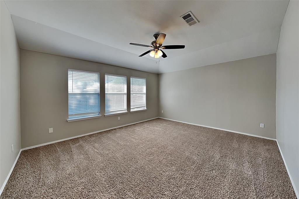 7016 Raintree Way Denton, TX 76210 - Photo 8 of 18 a view of an empty room with a window