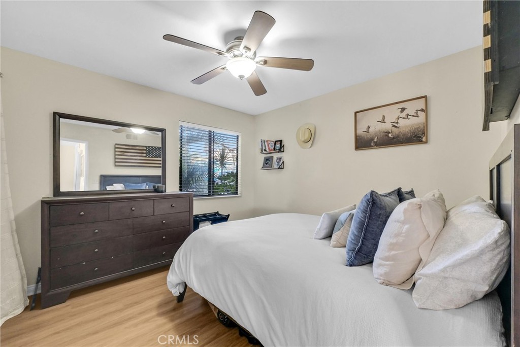24351 Pasto Road Dana Point, CA 92629 - Photo 13 of 30 a bedroom with a large bed and a window