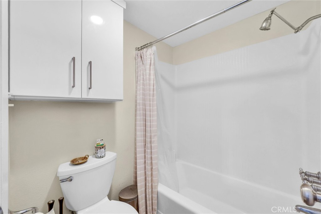 24351 Pasto Road Dana Point, CA 92629 - Photo 16 of 30 a white toilet sitting next to a bath tub