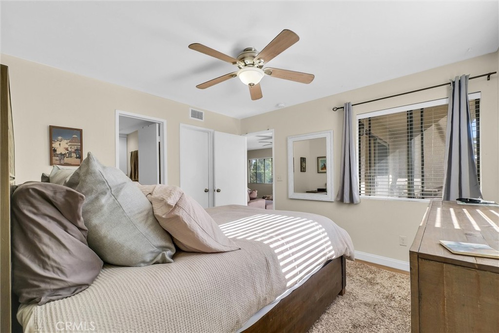 24351 Pasto Road Dana Point, CA 92629 - Photo 18 of 30 a bed room with a bed and a large window