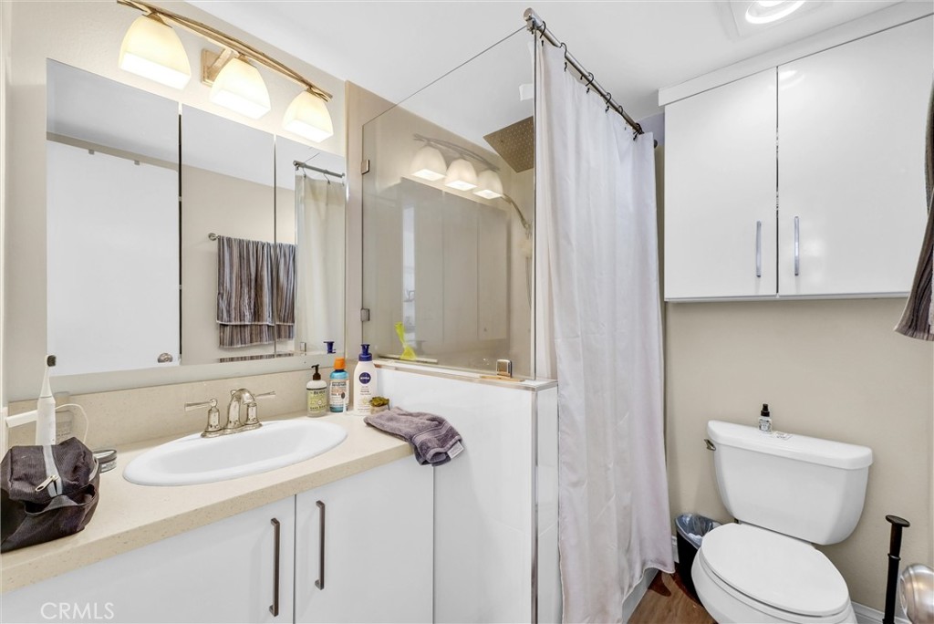 24351 Pasto Road Dana Point, CA 92629 - Photo 19 of 30 a bathroom with a sink toilet and shower