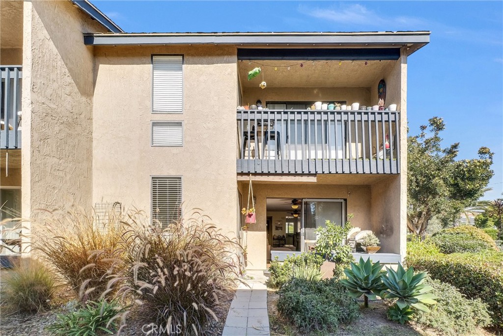24351 Pasto Road Dana Point, CA 92629 - Photo 23 of 30 a front view of a house with a yard