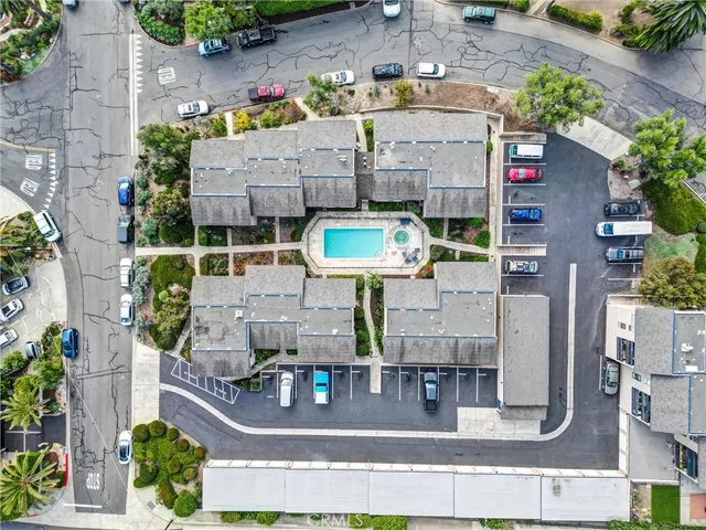 an aerial view of residential houses with outdoor space