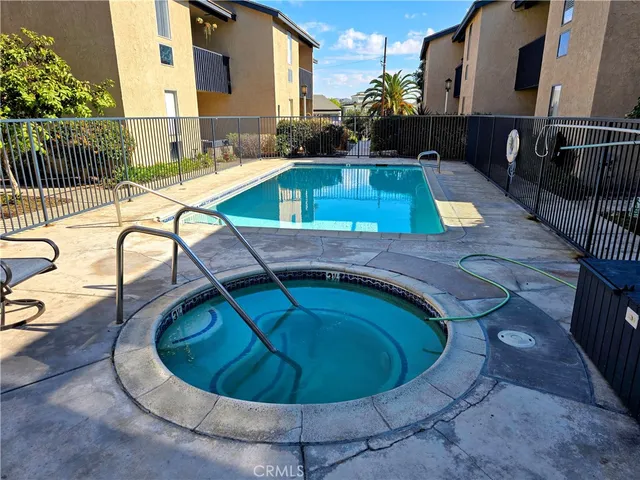 a view of a swimming pool with a lounge chair
