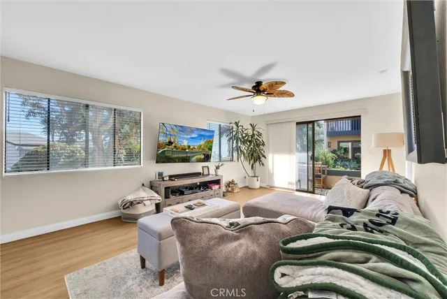 a bedroom with furniture and a flat screen tv