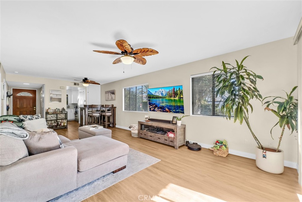 24351 Pasto Road Dana Point, CA 92629 - Photo 6 of 30 a living room with furniture and a flat screen tv