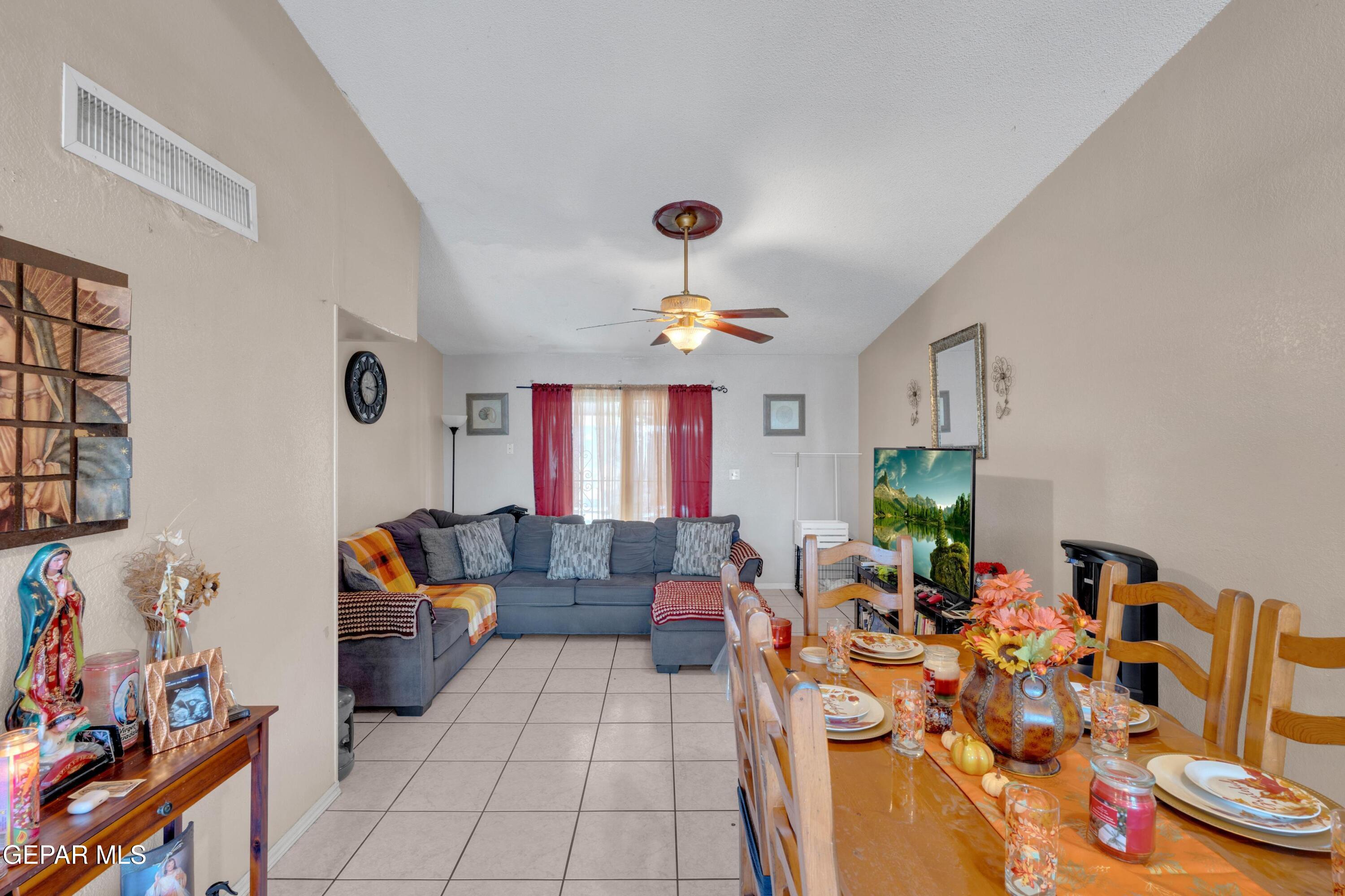 810 Silvestre Road El Paso, TX 79907 - Photo 12 of 33 a living room with furniture chess table and a fireplace