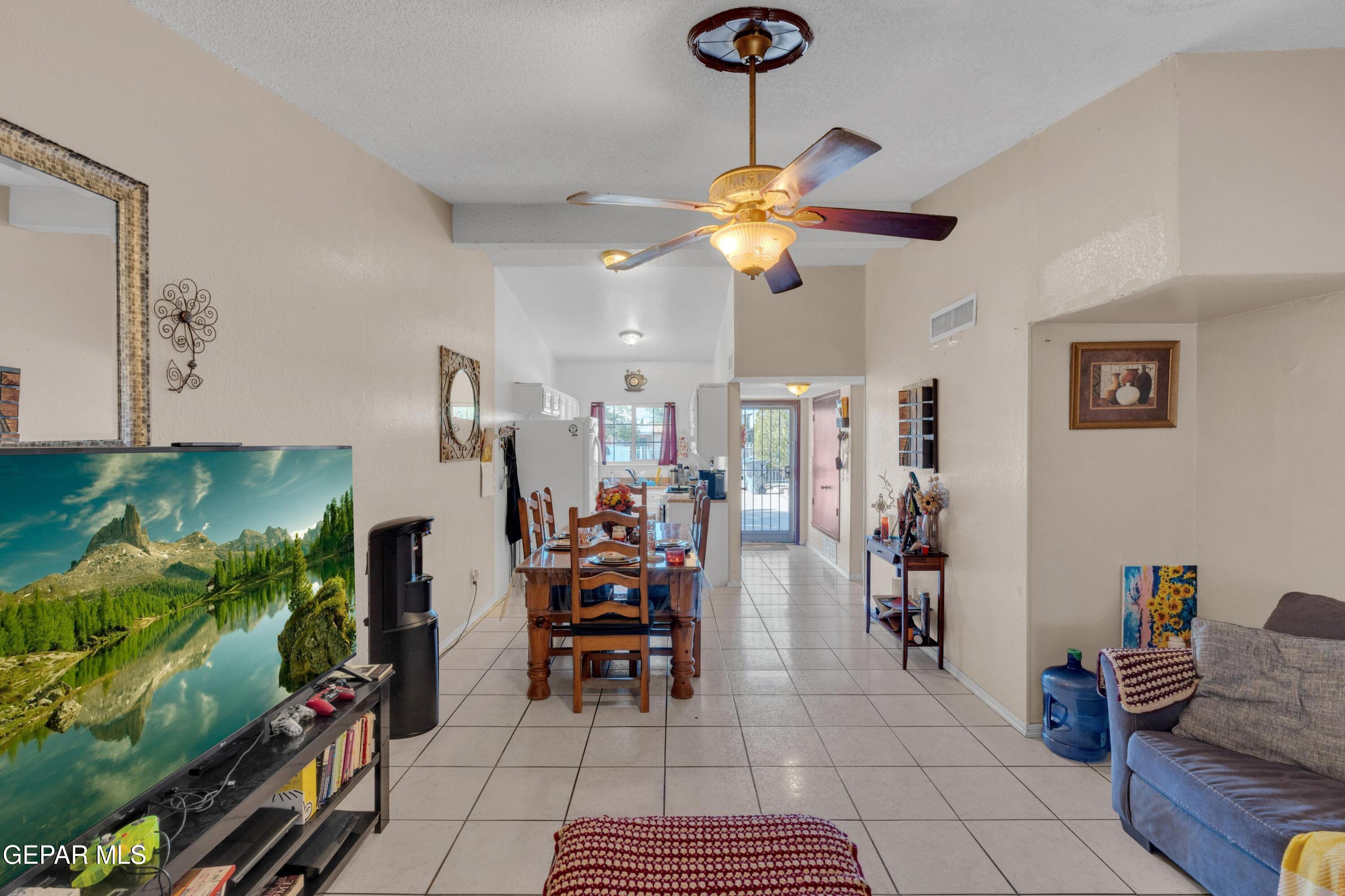 810 Silvestre Road El Paso, TX 79907 - Photo 13 of 33 a view of a livingroom with furniture and a ceiling fan