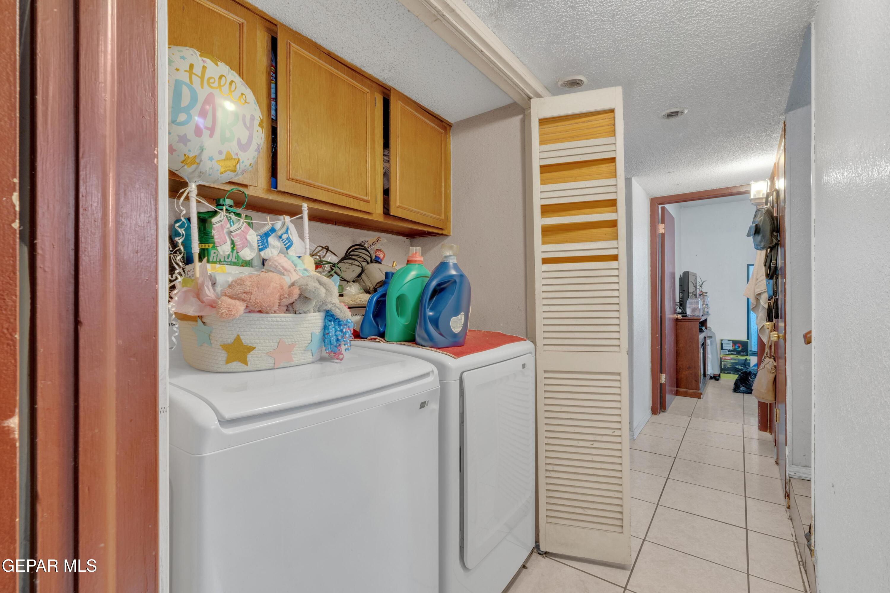 810 Silvestre Road El Paso, TX 79907 - Photo 26 of 33 a utility room with dryer and washer