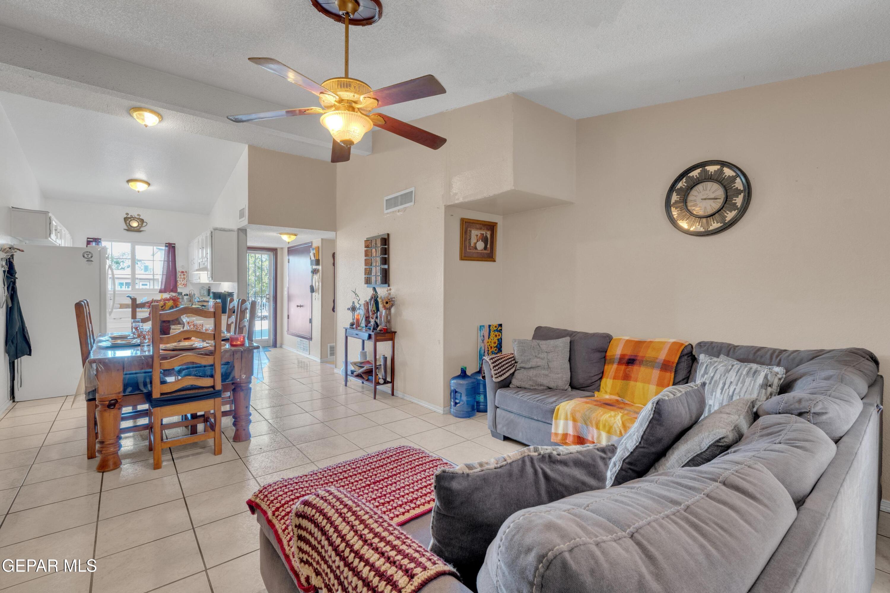810 Silvestre Road El Paso, TX 79907 - Photo 6 of 33 a living room with furniture and a chandelier