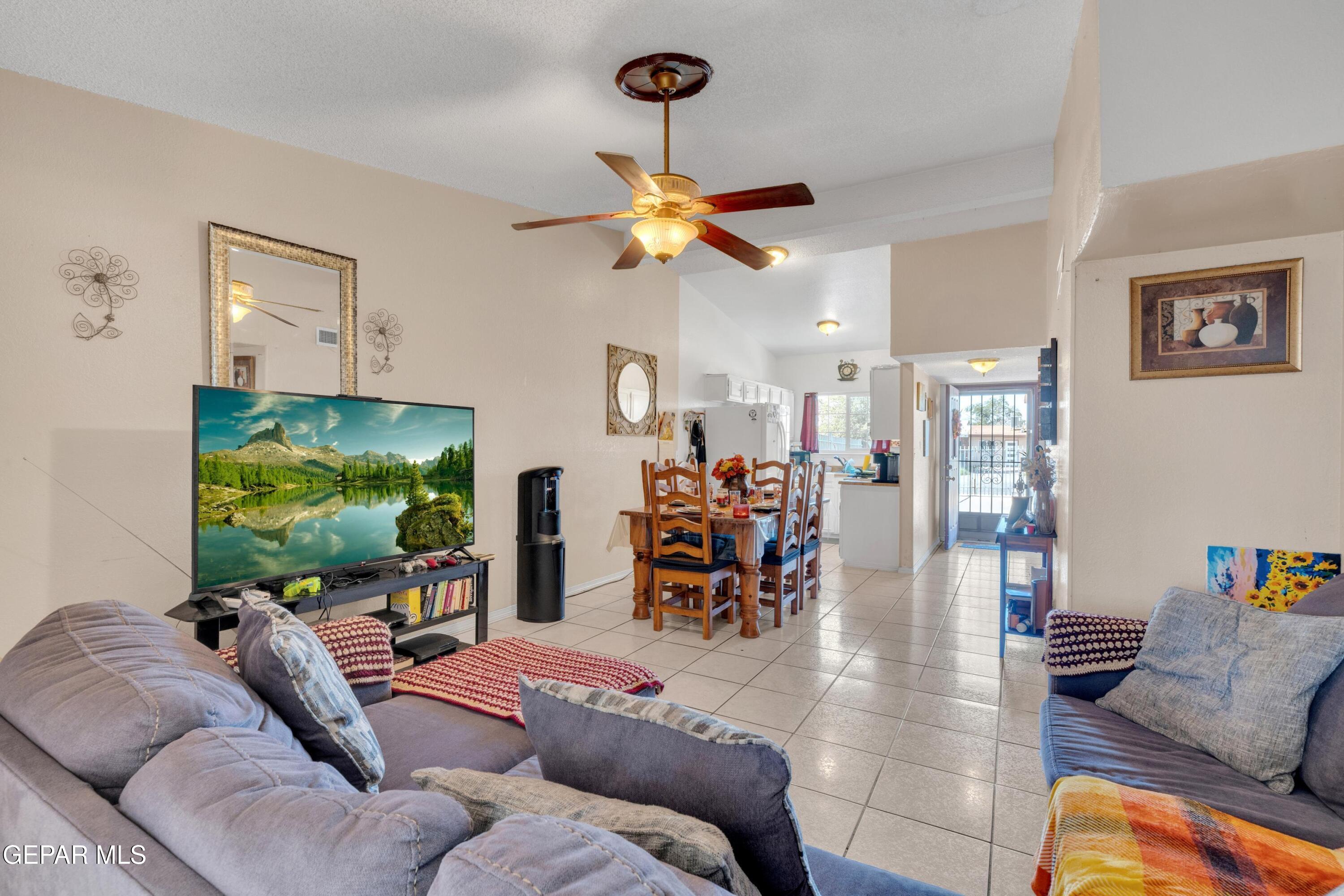 810 Silvestre Road El Paso, TX 79907 - Photo 7 of 33 a living room with furniture and a flat screen tv