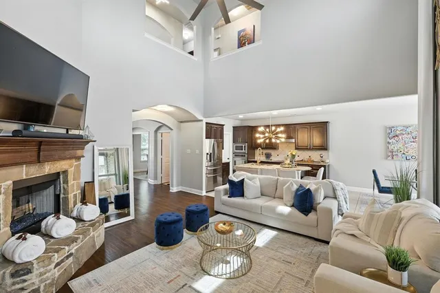 a living room with furniture and a fireplace