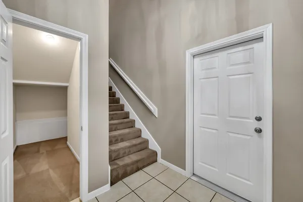 a view of entryway with wooden floor