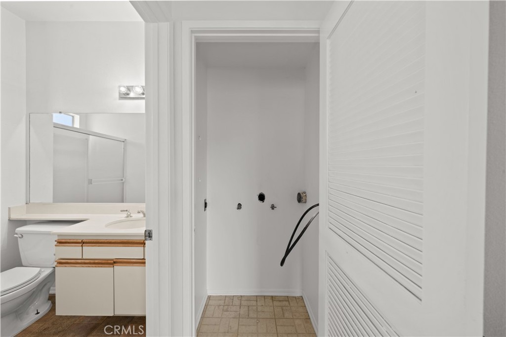 27645 Susan Beth Way, Unit A Saugus, CA 91350 - Photo 19 of 26 a bathroom with a sink toilet and shower