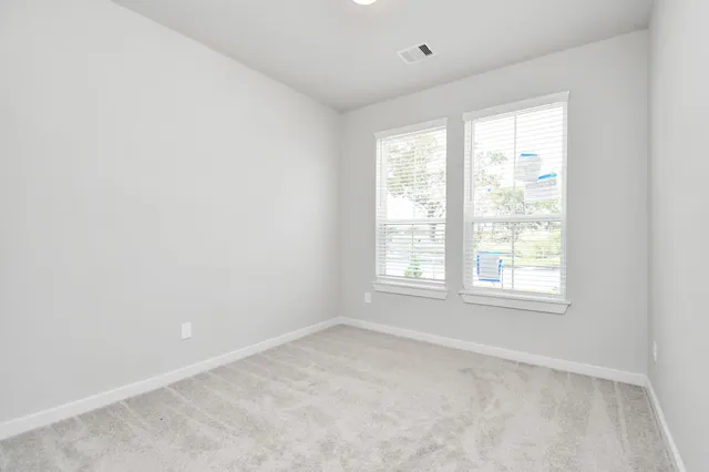 a spacious bathroom with a large tub sink and vanity