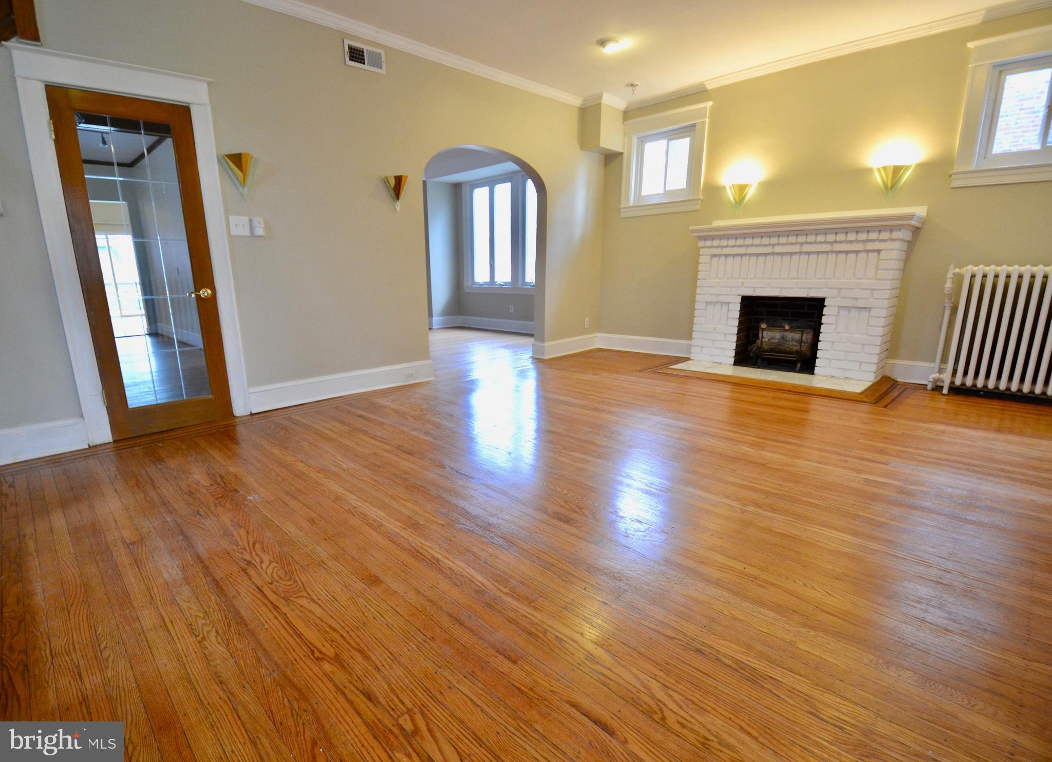 3709 Dennlyn Road Baltimore, MD 21215 - Photo 6 of 23 Original hardwood floors and fireplace with mantel