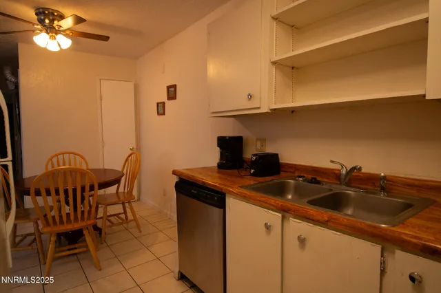 a kitchen that has a sink and cabinets