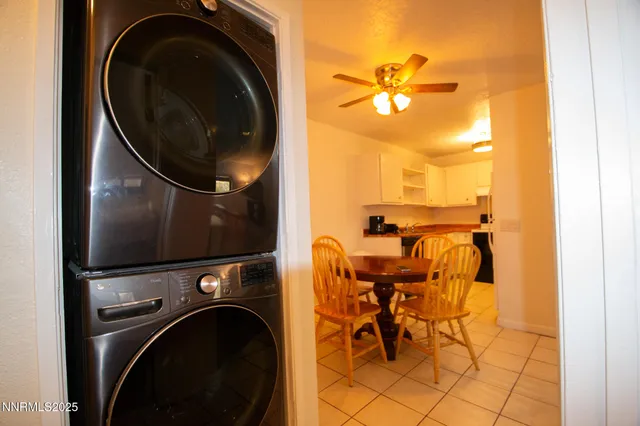 a view of a living room with washer and dryer