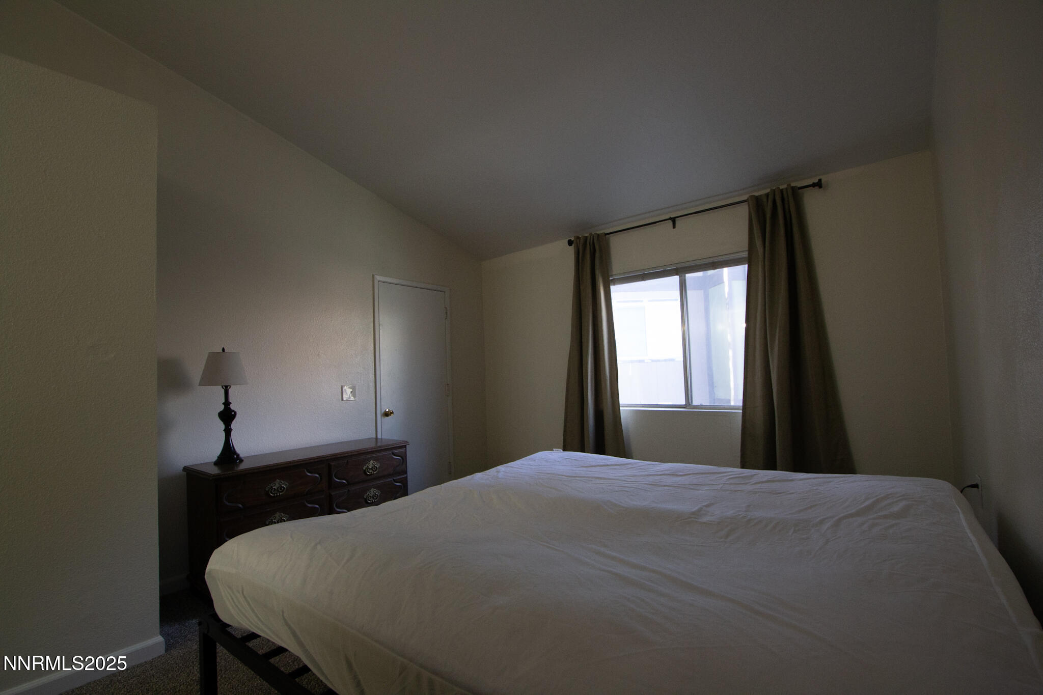 2080 Highview Court, Unit 2 Reno, NV 89512 - Photo 6 of 11 a bedroom with a bed and a window