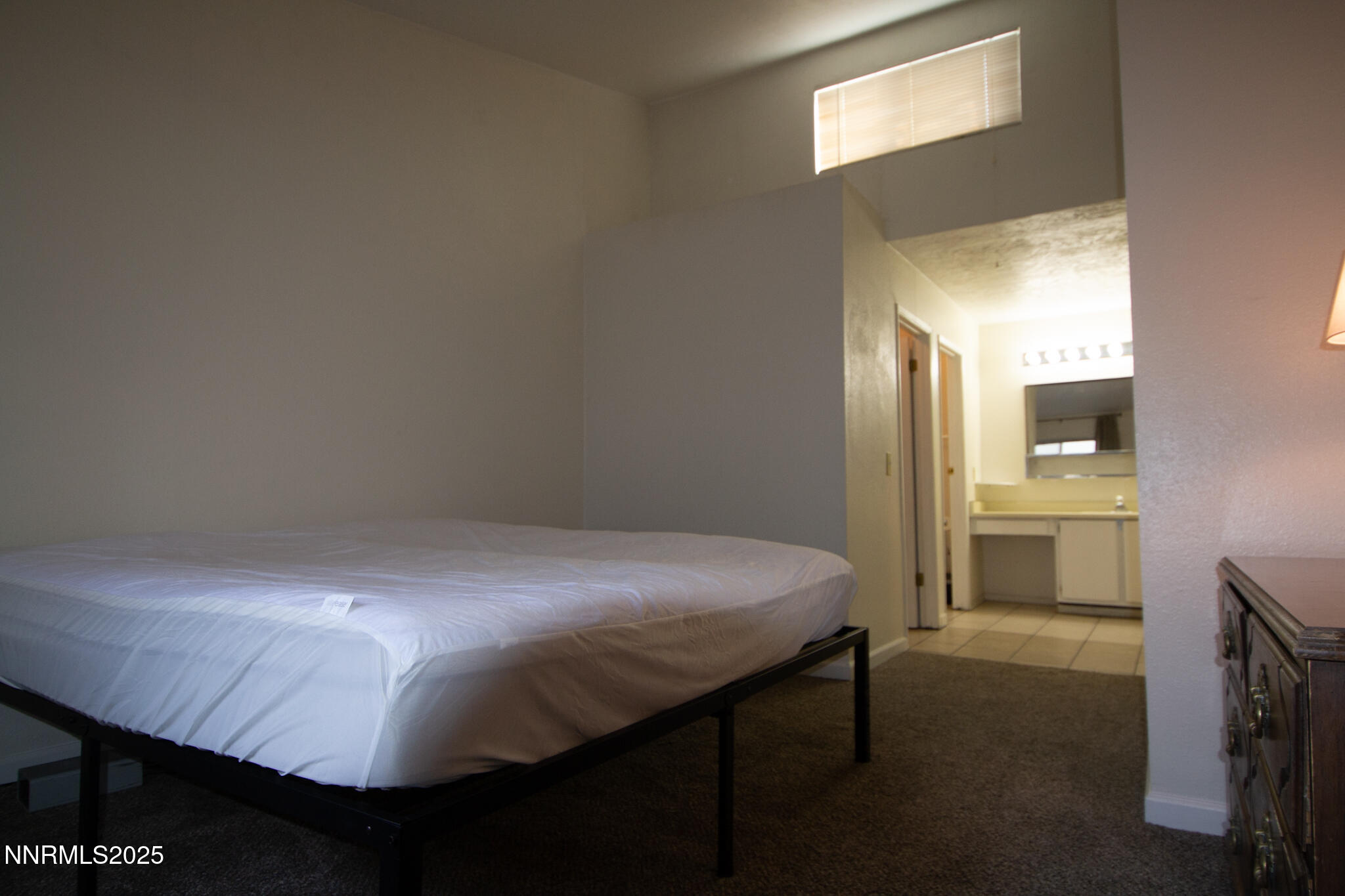 2080 Highview Court, Unit 2 Reno, NV 89512 - Photo 7 of 11 a room with a bed and a view of kitchen