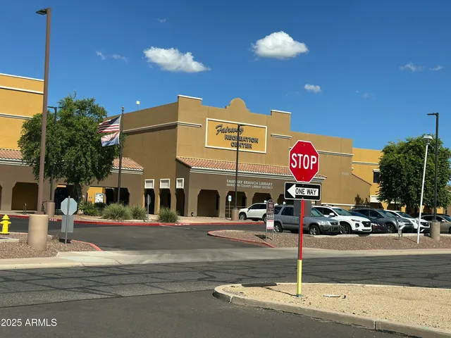 a front view of a building with street view