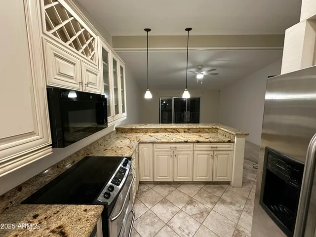 a kitchen with a stove and a sink