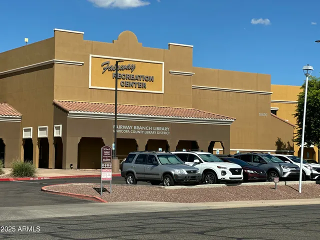 a view of street with parked cars