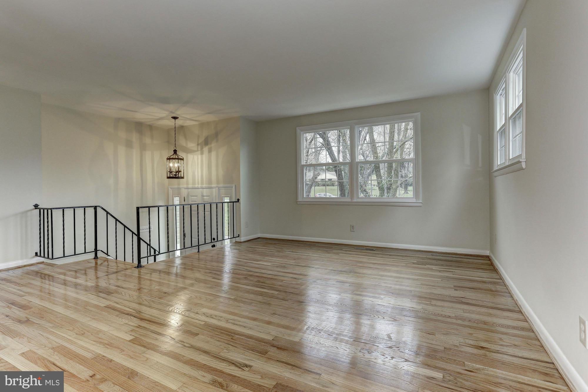 5010 Durham Road East Columbia, MD 21044 - Photo 3 of 30 a view of an empty room with wooden floor and a window