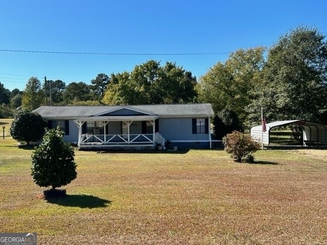 527 Johnny Cut Road Griffin, GA 30223 - Photo 1 of 1 a front view of a house with yard covered in snow