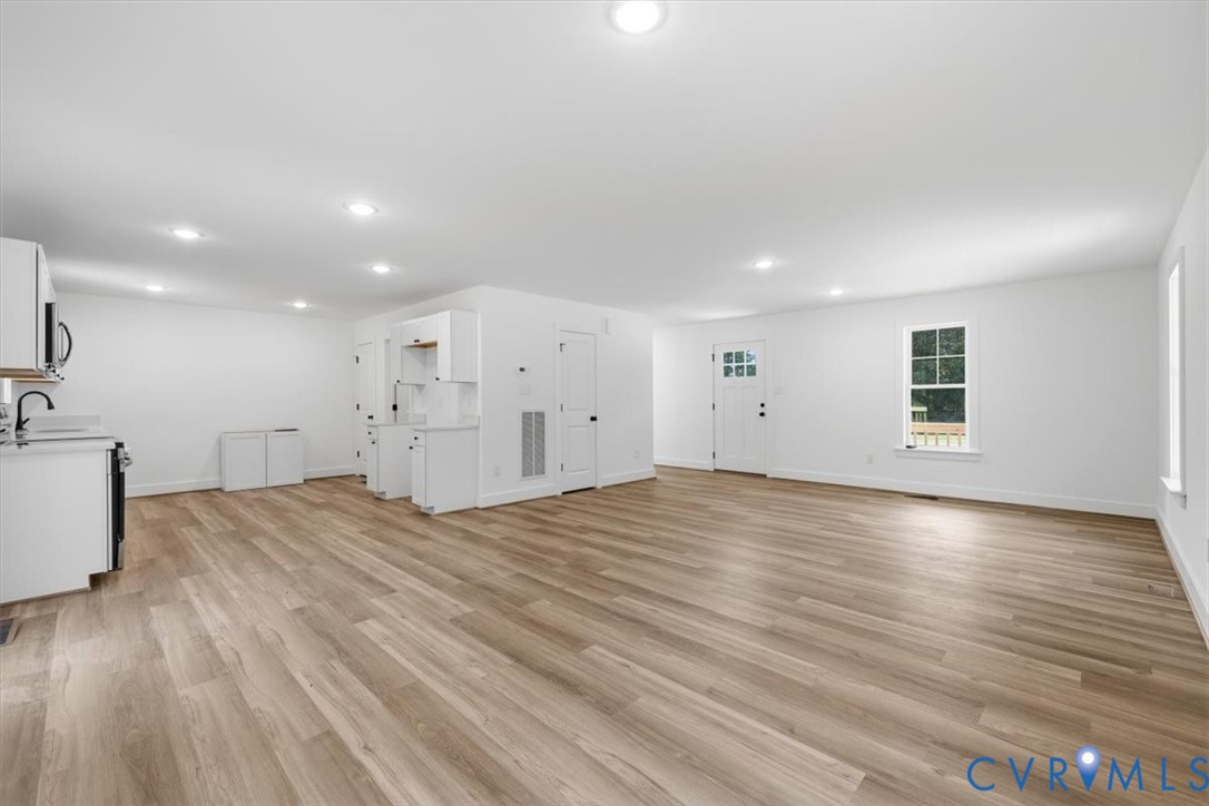 654 Frenchs Store Road Cumberland, VA 23040 - Photo 5 of 24 Open-concept living space featuring wood-finish fl