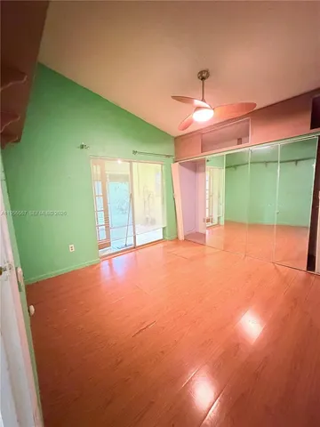 a view of a big room with a big yard and plants