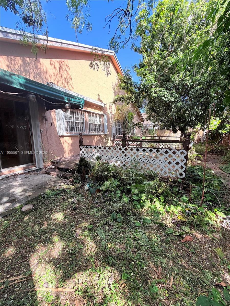 11334 Southwest 152nd Terrace Miami, FL 33157 - Photo 17 of 20 a view of a house with a tree