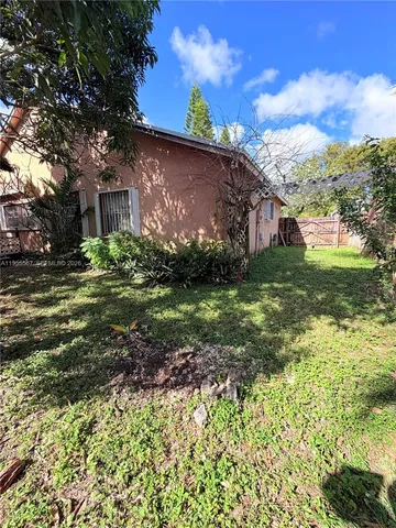a backyard of a house with lots of green space