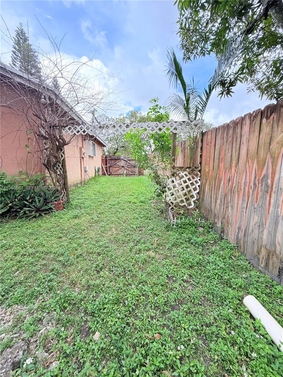 11334 Southwest 152nd Terrace Miami, FL 33157 - Photo 19 of 20 a view of a backyard with garden
