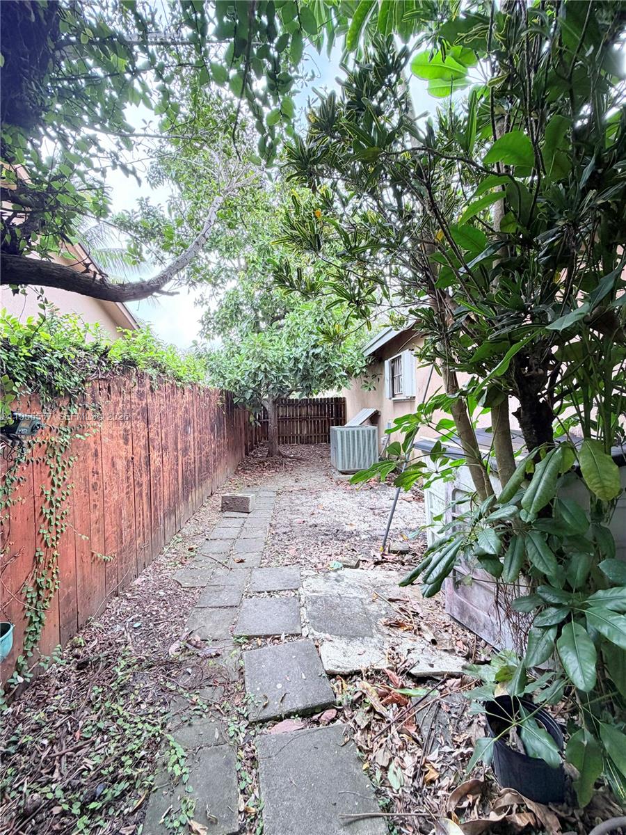 11334 Southwest 152nd Terrace Miami, FL 33157 - Photo 20 of 20 a backyard of a house with lots of green space