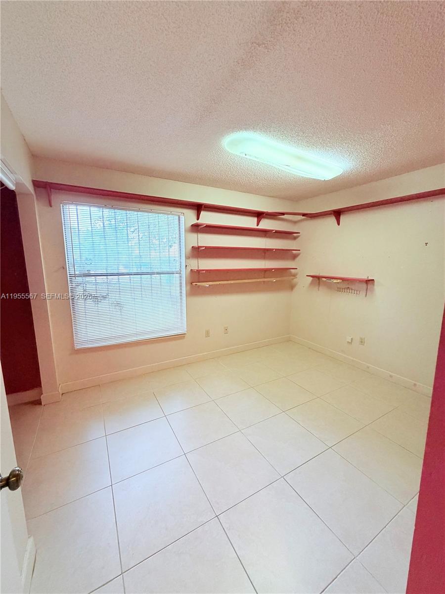 11334 Southwest 152nd Terrace Miami, FL 33157 - Photo 5 of 20 a view of a room with storage and utility