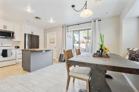 a kitchen with sink cabinets and wooden floor