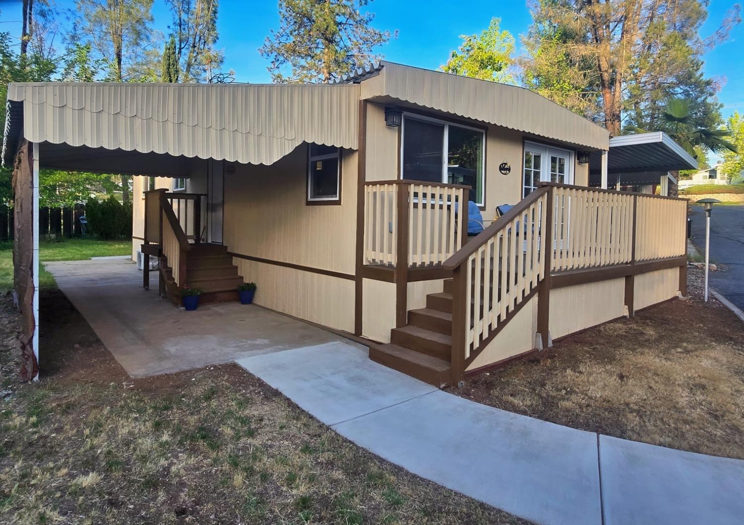 a view of a house with wooden fence