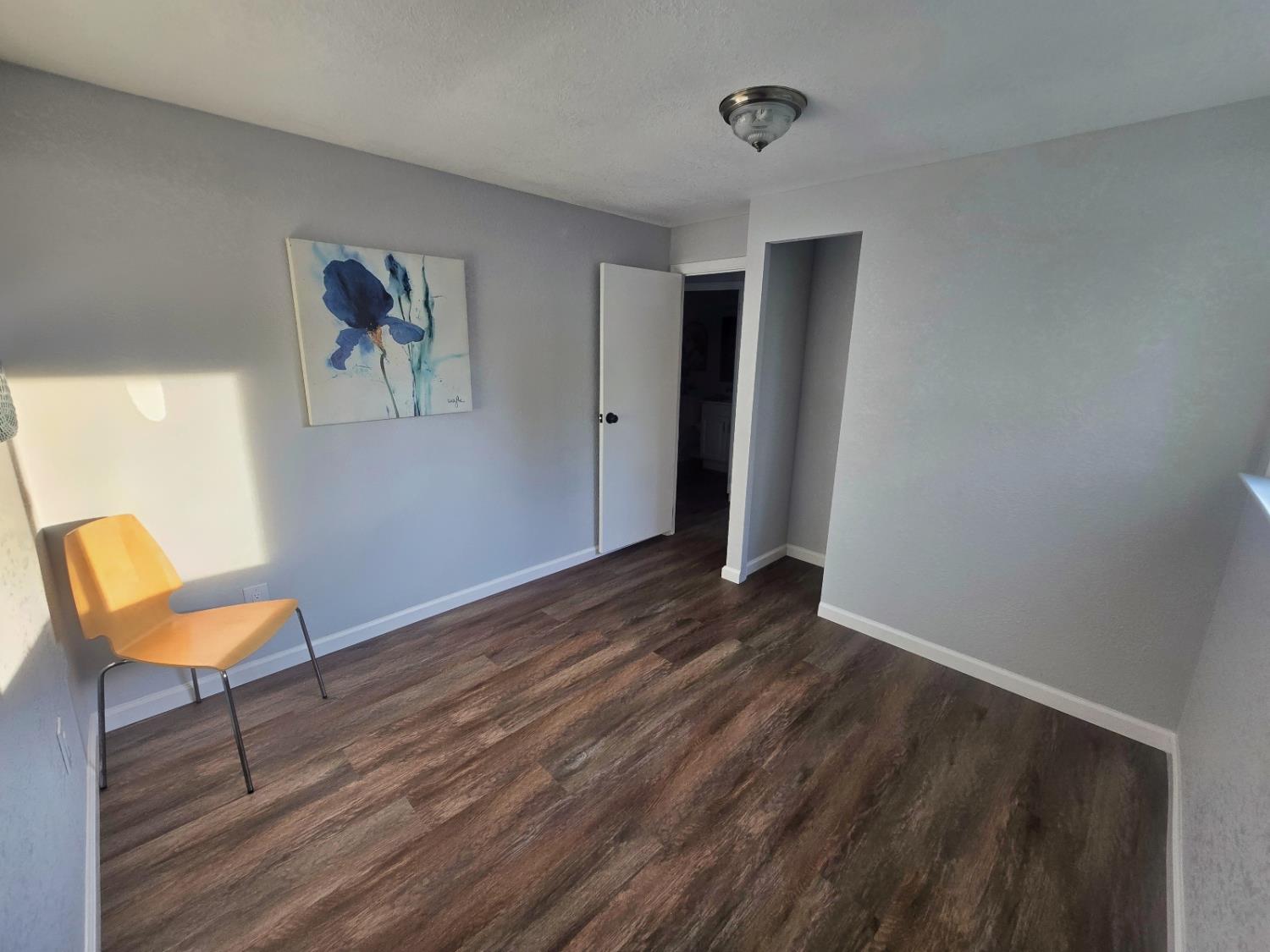 450 Gladycon Road, Unit 3 Colfax, CA 95713 - Photo 21 of 27 a view of a room with wooden floor and a ceiling fan