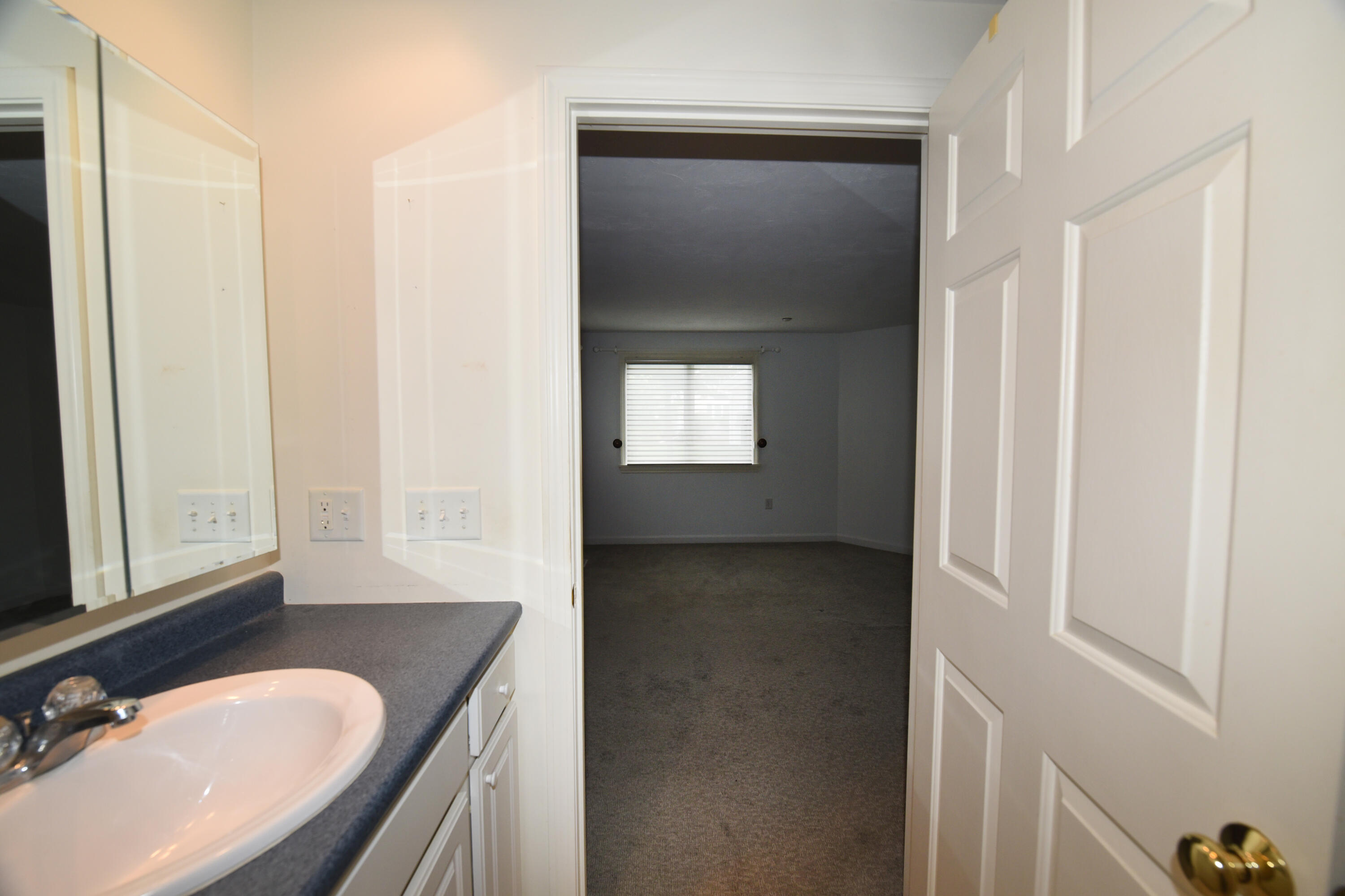 23 North Ridge Road Mashpee, MA 02649 - Photo 20 of 38 a bathroom with a granite countertop sink and a mirror