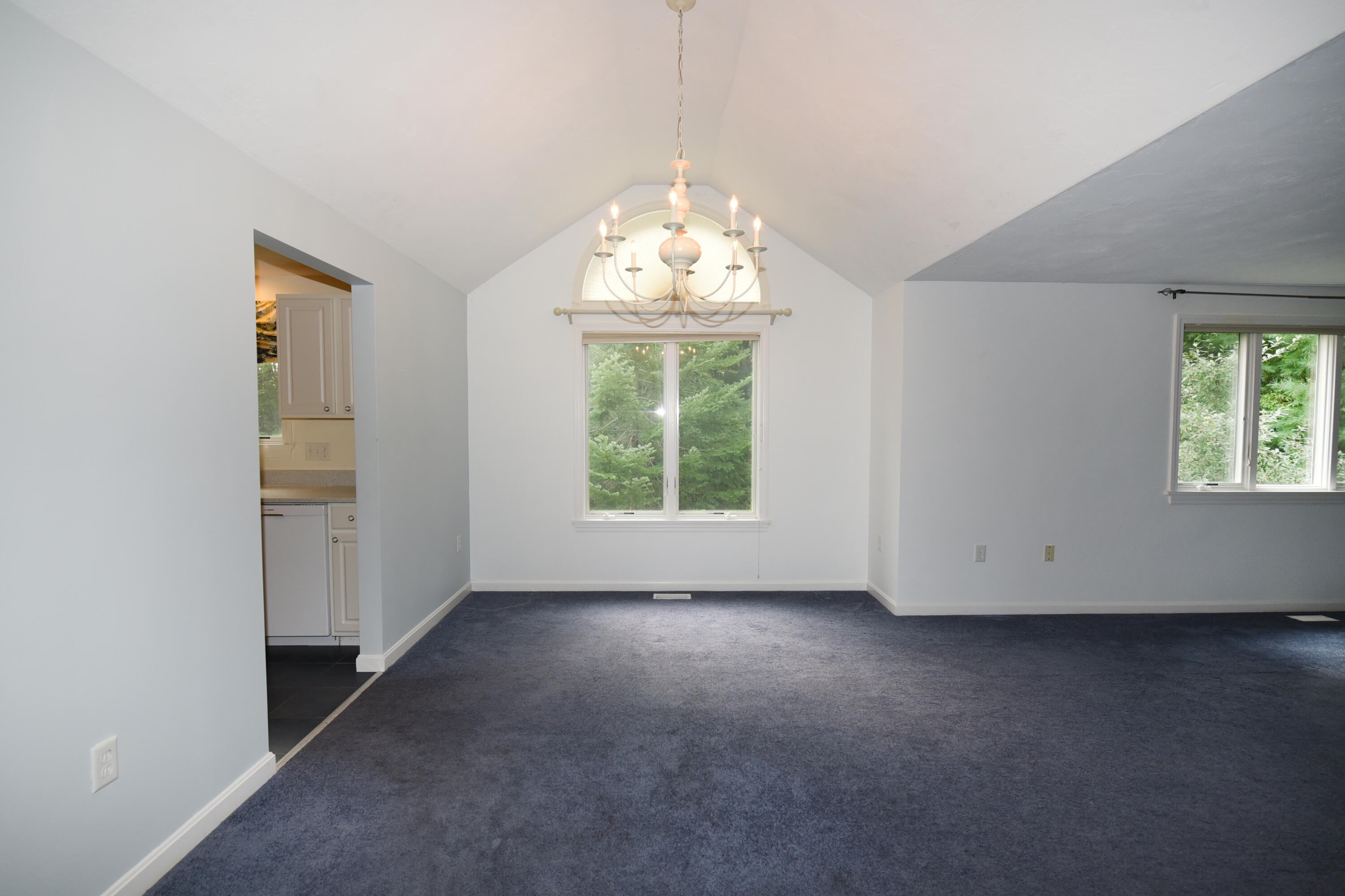 23 North Ridge Road Mashpee, MA 02649 - Photo 9 of 38 an empty room with windows and chandelier