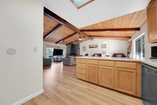 a bathroom with a sink a toilet and shower curtain