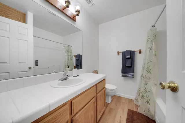 a bedroom with a bed and a chair